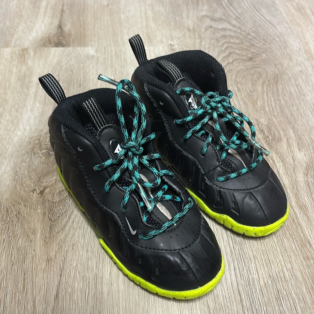 Nike Kids Black Sneakers with Neon Yellow Soles and Teal Laces